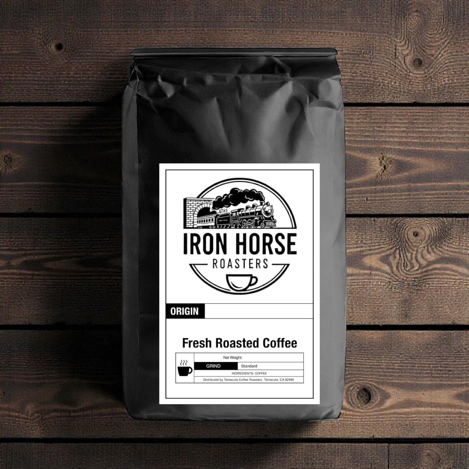 Coffee bag with Iron Horse Roasters label on a wooden surface